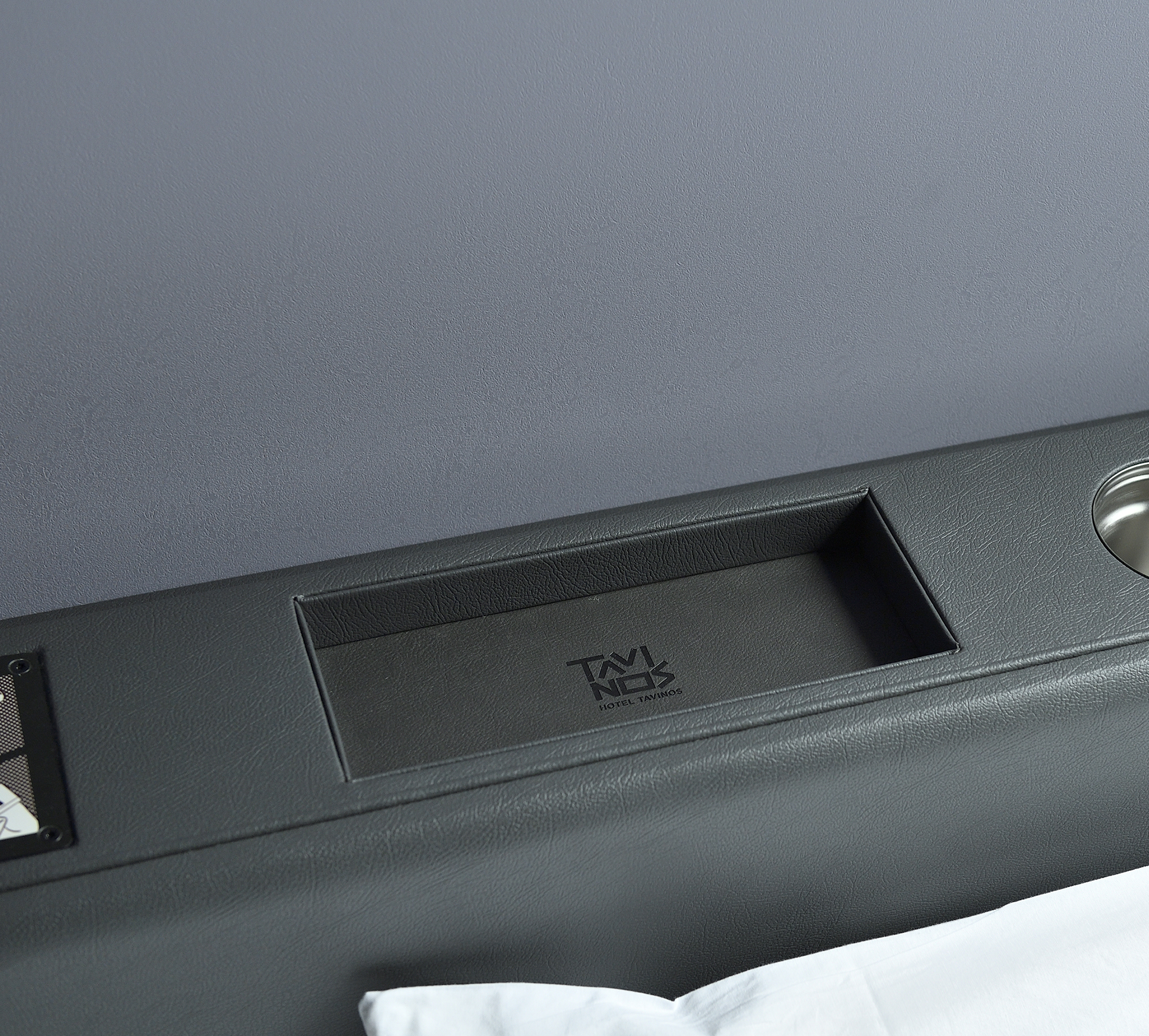 A drink holder and small tray, which are perfect for placing your phone and drink on, are available at the bedside.