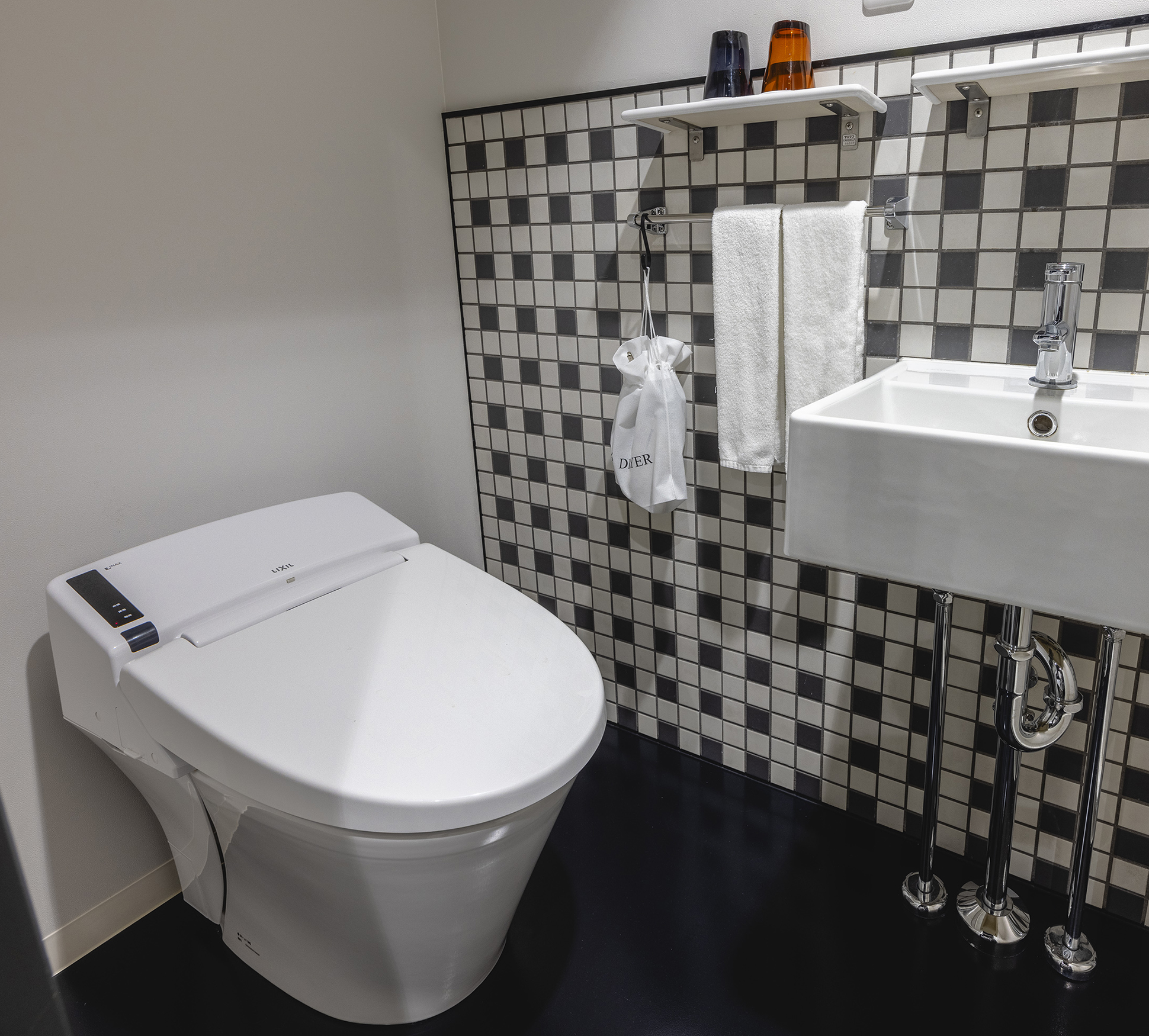 The bathroom has a toilet with a bidet function.